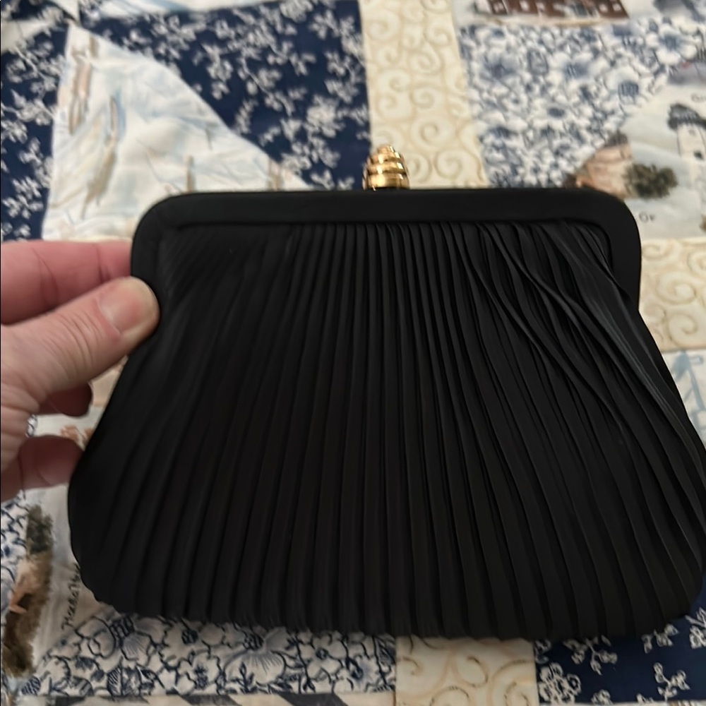 Small evening clutch purse with straps.